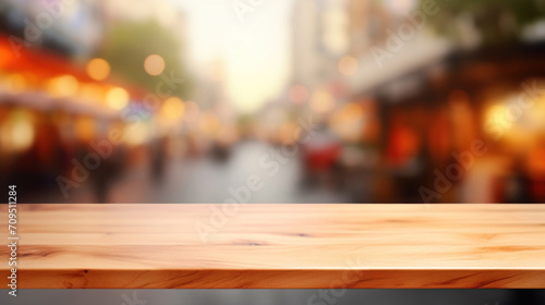 Empty wooden tabletop with a warm  blurred background of a bustling street market  perfect for product display.