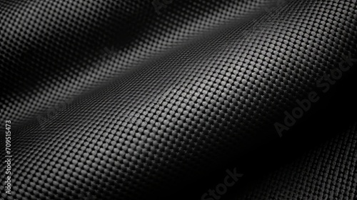 Black rubber-coated technical fabric texture with light reflections and shadows