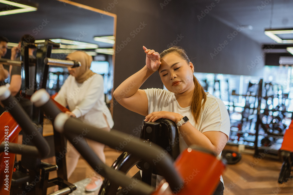 potrait of asian woman doing cardio workout exercise in gym potrait of asian woman doing cardio workout exercise in gym