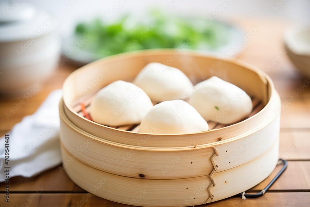 fresh bao buns in bamboo steamer with steam fresh bao buns in bamboo steamer with steam