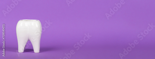 Obraz na płótnie White ceramic tooth in bright colorful background. Free space for text. Banner. w salonie
