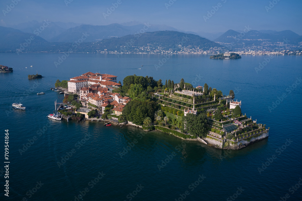 Aerial view of Isola Bella drone panoramic view. Panorama at sunset on Lake Maggiore top view. Borromean Islands, Lake Maggiore, Piedmont, Europe. Lake Maggiore, island, Isola Bella, Italy.