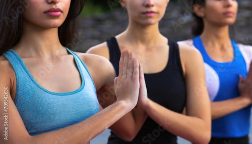 women doing yoga, group at meditation or yoga in sport clothes