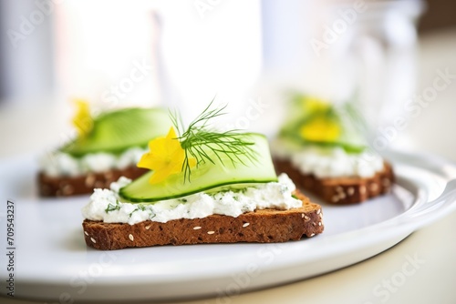 rye bread with cottage cheese and sliced cucumber photo