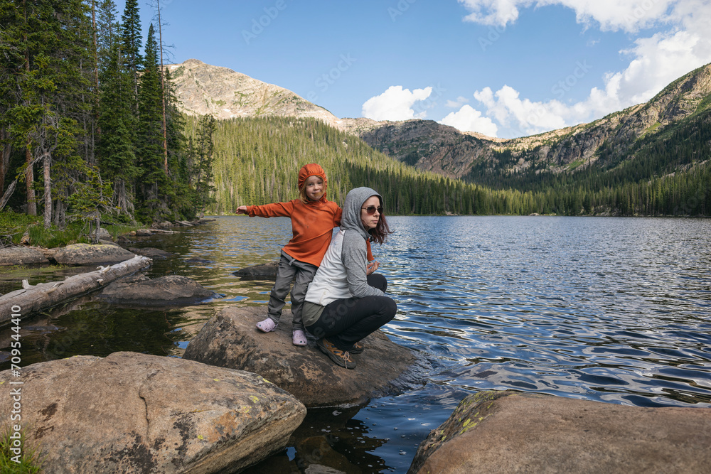 Mother and child enjoying a lakeside adventure together