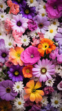 Colorful bouquet of different flowers as a background, top view.