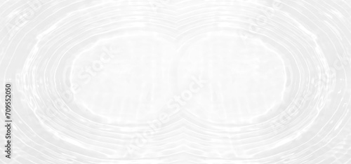 White water with ripples on the surface. Defocus blurred transparent white colored clear calm water surface texture with splashes and bubbles. Water waves with shining pattern texture background.