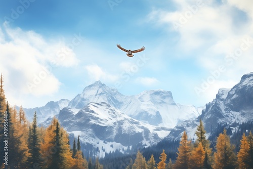 eagle soaring above alpine trees and peaks photo