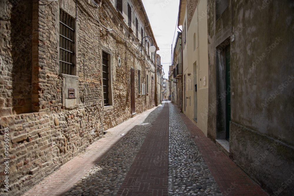 Narrow stone-paved street, Italy, ancient architecture, old town, travel in Italy, Europe, tourism, background