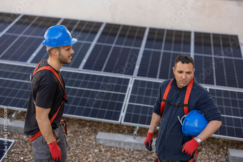 Photos Rooftops become canvases for change as workers meticulously install solar panels, painting a picture of a future where renewable energy graces every home