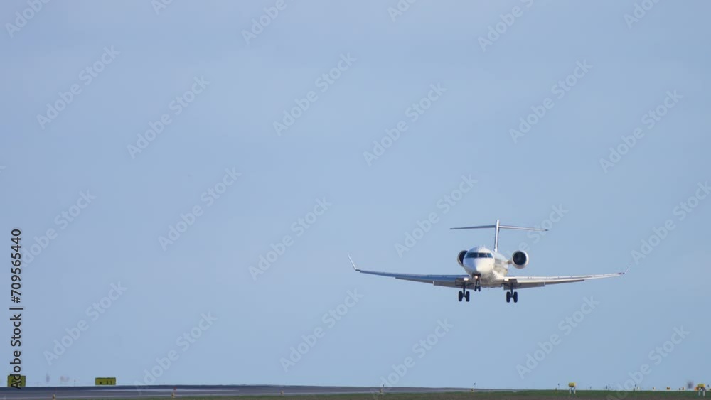 Front view of jet plane landing. Beautiful view of airliner in blue sky. Airplane approaching and landing at early morning. Passenger plane fly down on runway Front view of jet plane landing. Beautiful view of airliner in blue sky. Airplane approaching and landing at early morning. Passenger plane fly down on runway