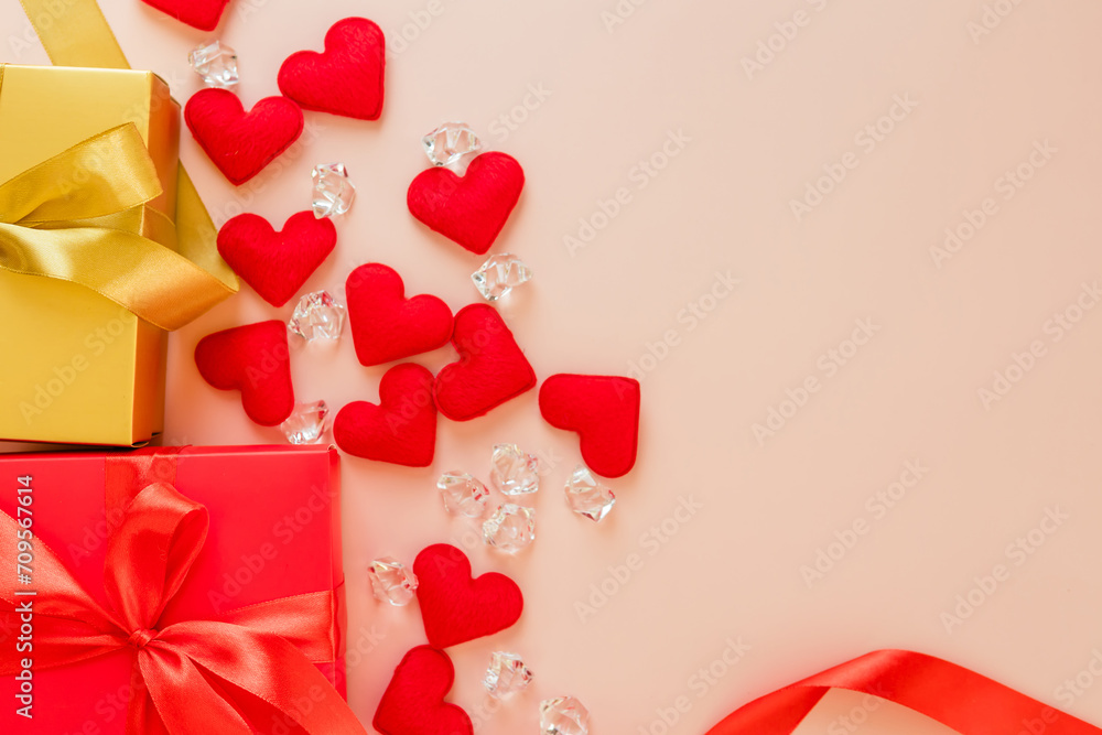 Valentine's Day decorations concept. Top view photo of gift boxes with rose and heart on pink background with copyspace
