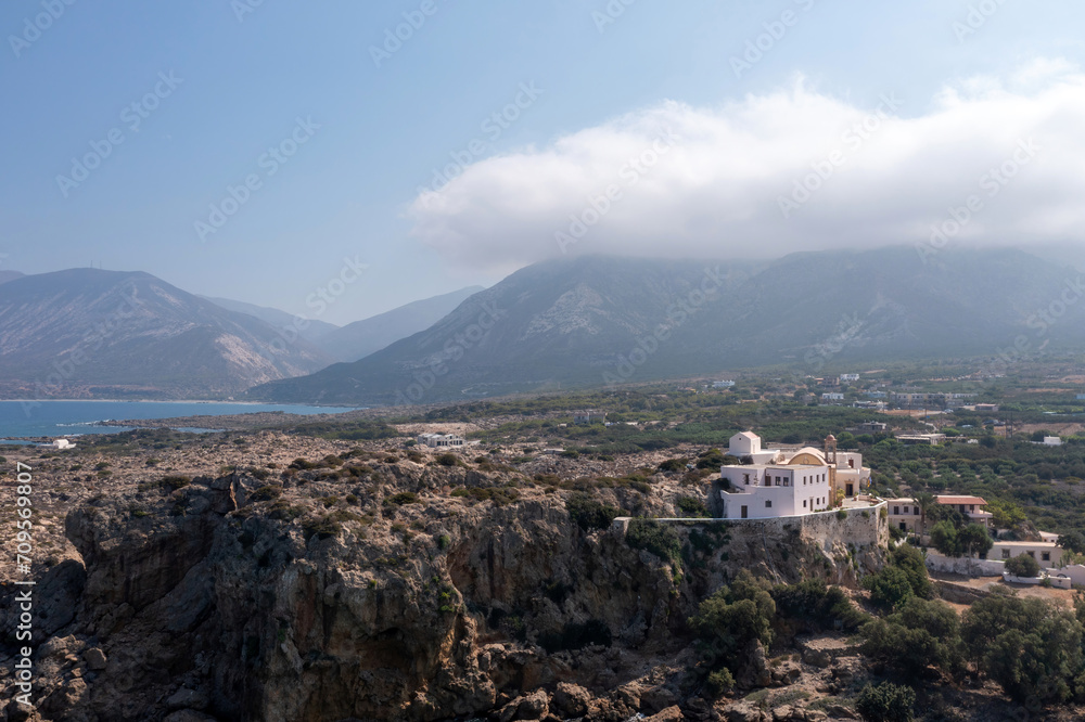 Chania town Crete island, Greece, Chrysoskalitissa Monastery built up on rock. Aerial drone view.