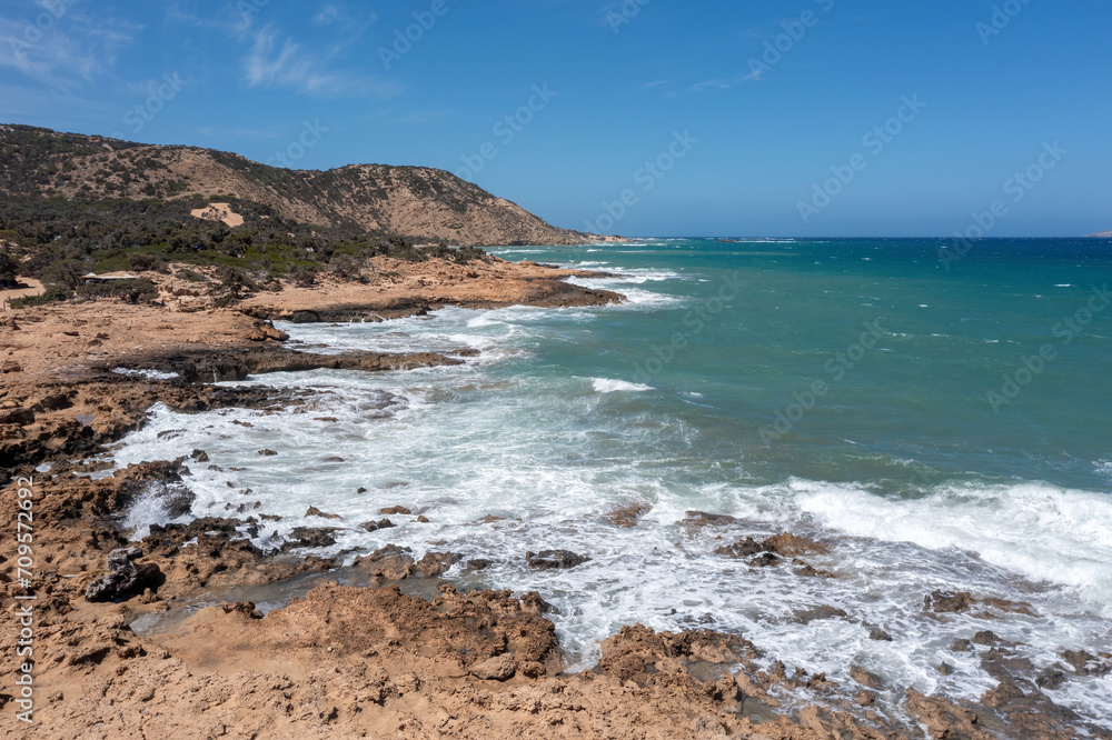 Crete, Greece, Gavdos island. Aerial drone view of ripple sea water splashing the beach, nature. Crete, Greece, Gavdos island. Aerial drone view of ripple sea water splashing the beach, nature.