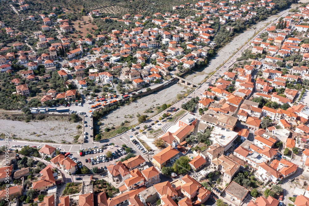 Leonidio, Arcadia, Peloponnese, Greece. Aerial drone view panoramic of town, dry Dafnon river bed.