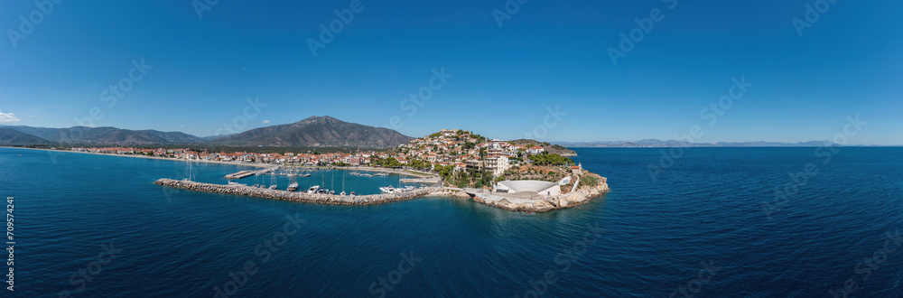 Paralio Astros port, Peloponnese Greece. Aerial drone panoramic view of town, boat, sea, sky. Banner
