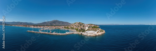 Paralio Astros port, Peloponnese Greece. Aerial drone panoramic view of town, boat, sea, sky. Banner