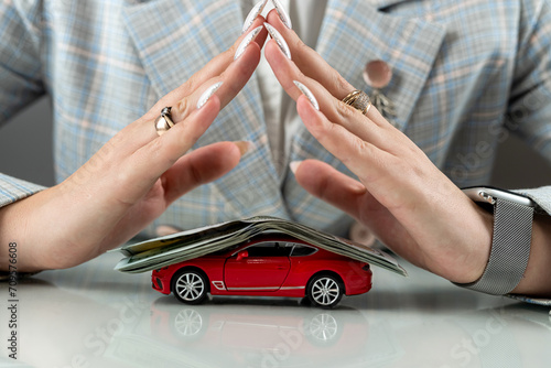 Insurance or protect car with dollar money and hand of vechicle