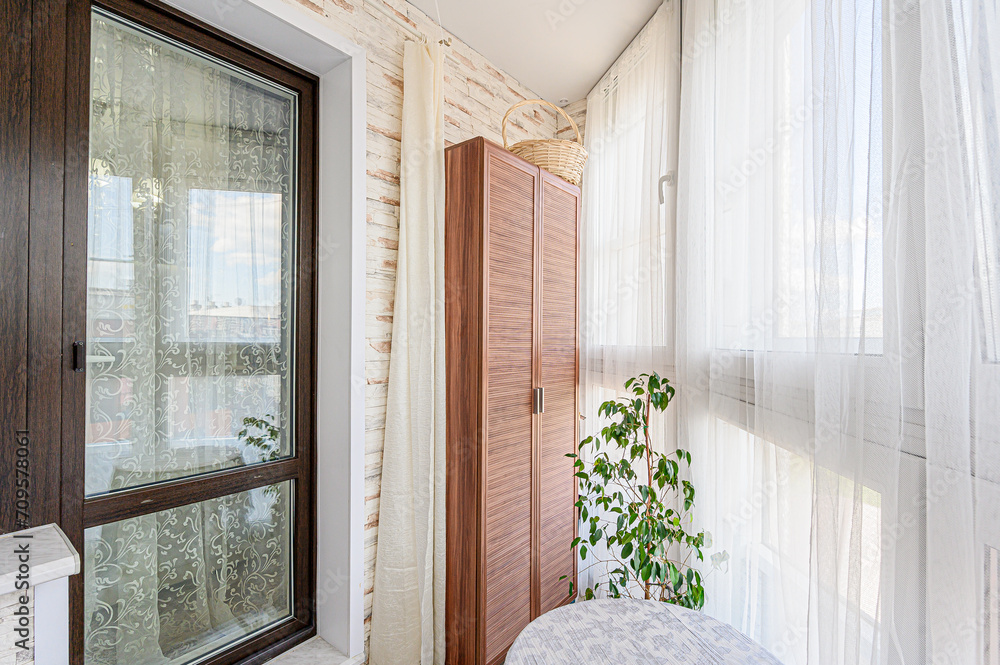 Fototapeta premium Russia, Moscow- May 27, 2020: interior apartment room balcony overlooking the street