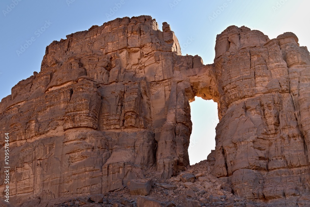 View of Tamezguida cathedrale rock formation in Tadrart Rouge rocky mountain range in Tassili n Ajjer National Park. Sahara desert, Algeria, Africa.