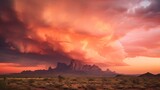 A fiery orange and pink sky during a dramatic desert monsoon in Arizona