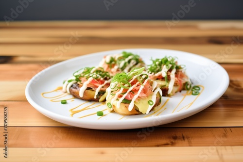 takoyaki served with drizzled mayo and green onion