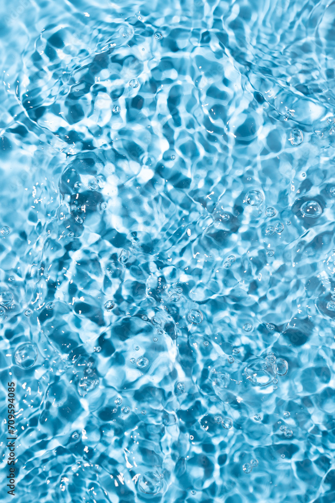 Water surface waving Close-up . Blue Water Flowing