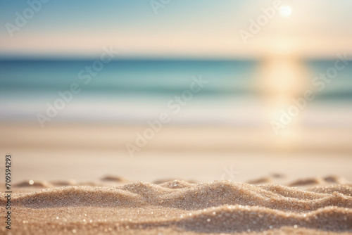 Seascape abstract beach background. blur bokeh light of calm sea and sky. Focus on sand foreground © Giuseppe Cammino