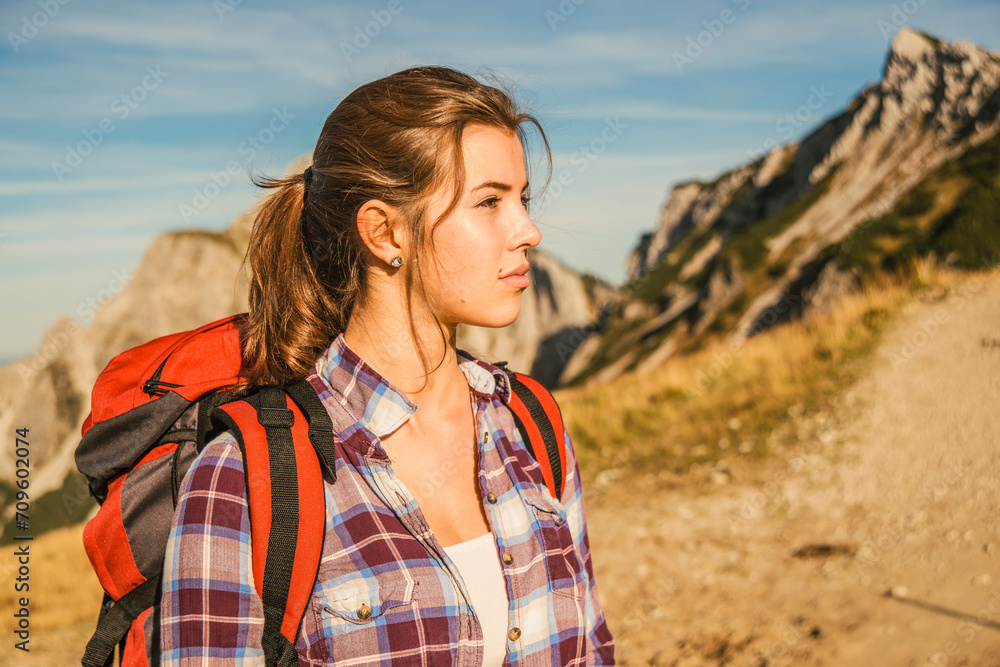 Young woman in Tannheimer Tal, Tyrol, Austria Young woman in Tannheimer Tal, Tyrol, Austria