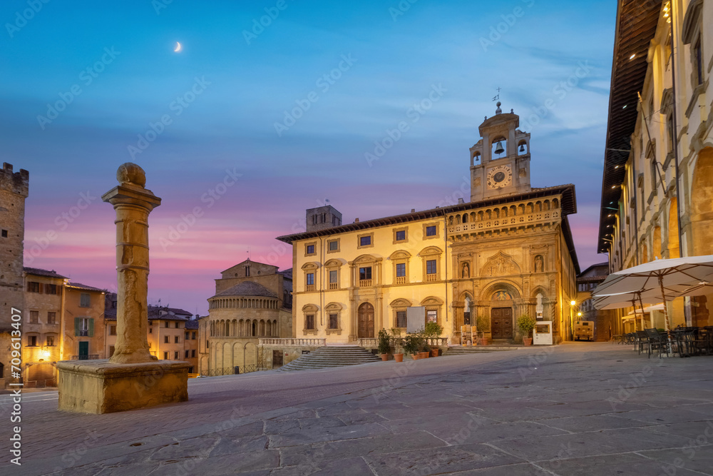 Arezzo, Italy. View of historic architecture on Piazza Grande square at dusk