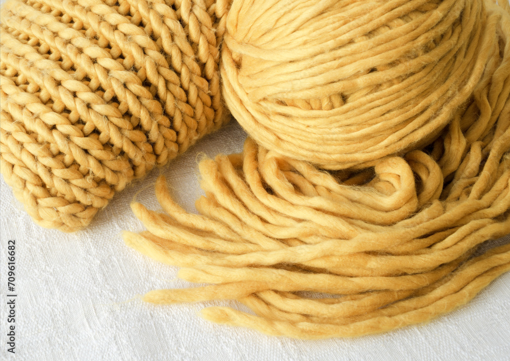 Knitting, scarf and ball of yellow yarn. Knitting, scarf and ball of yellow yarn.