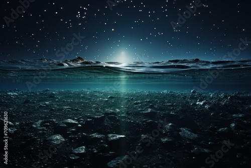  an underwater view of rocks and water with a bright light shining on the surface of the water and stars in the sky.