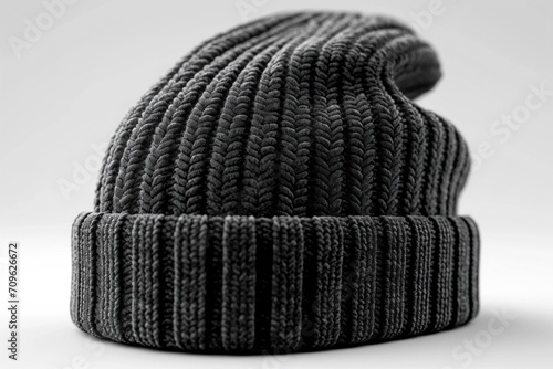 A blank black beanie hat is showcased against a pristine white background for design mockup purposes.