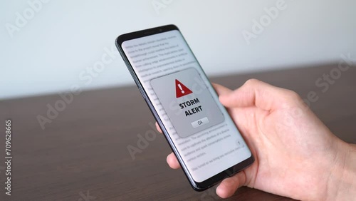 Wallpaper Mural Storm alert notification appearing on the phone while in use. Bad weather concept. Torontodigital.ca