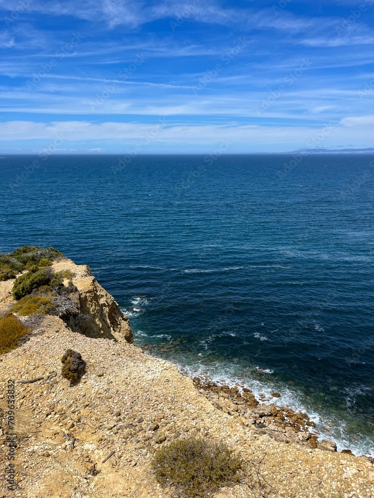 Beautiful rocky ocean coast, blue ocean horizon, natural ocean view