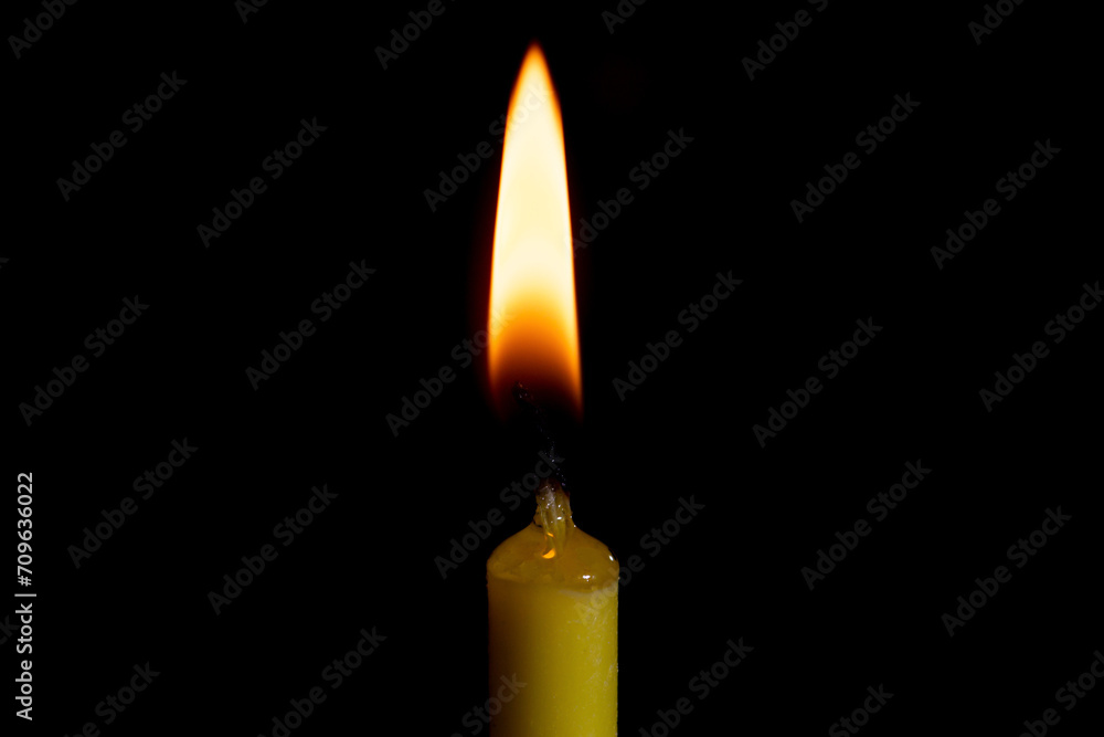 candle on the black background close up candle on the black background close up