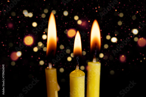 candles on the black background with bokeh close up