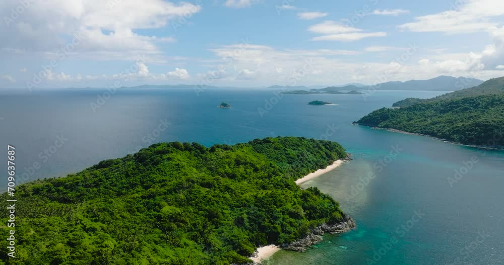 Islands with green plants and beach. Cagbuli Island in El Nido, Palawan. Philippines.