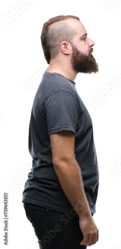 Young caucasian hipster man over isolated background looking to side, relax profile pose with natural face with confident smile.