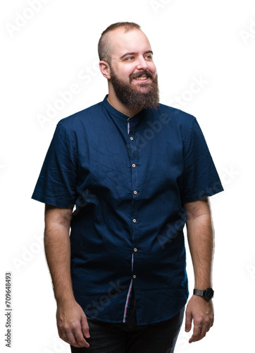 Young caucasian hipster man over isolated background smiling looking side and staring away thinking.