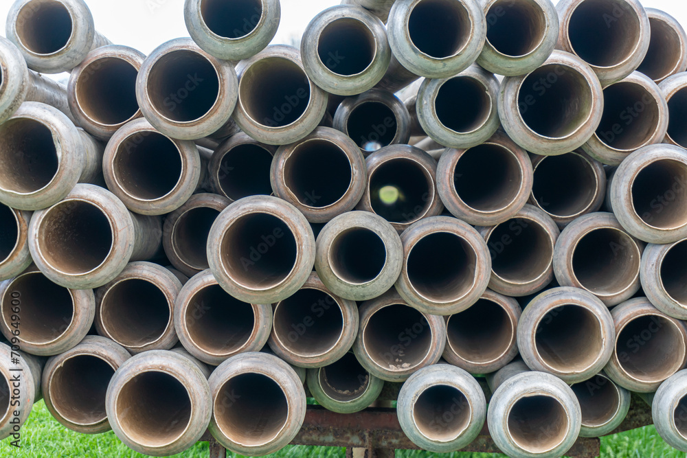 A lot of straight metal pipes, tubes loaded on a trailer A lot of straight metal pipes, tubes loaded on a trailer