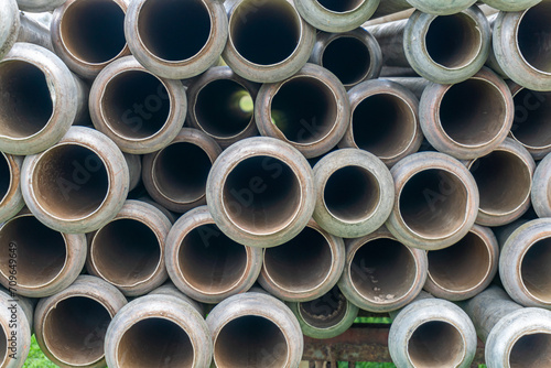 A lot of straight metal pipes  tubes loaded on a trailer