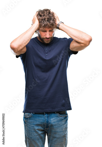 Fotografie Handsome hispanic model man over isolated background suffering from headache desperate and stressed because pain and migraine