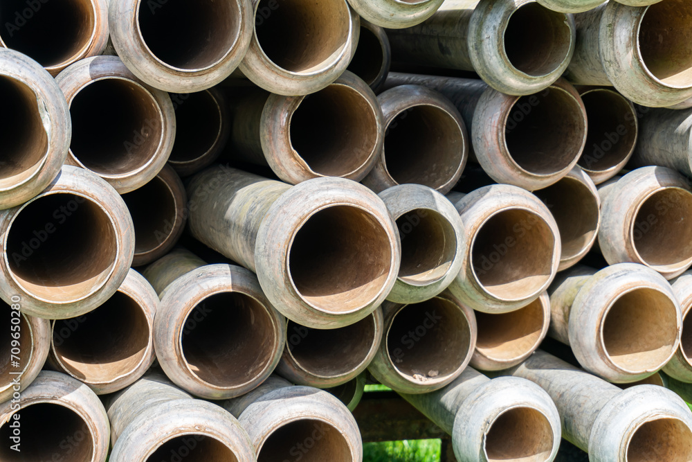 A lot of straight metal pipes, tubes loaded on a trailer A lot of straight metal pipes, tubes loaded on a trailer