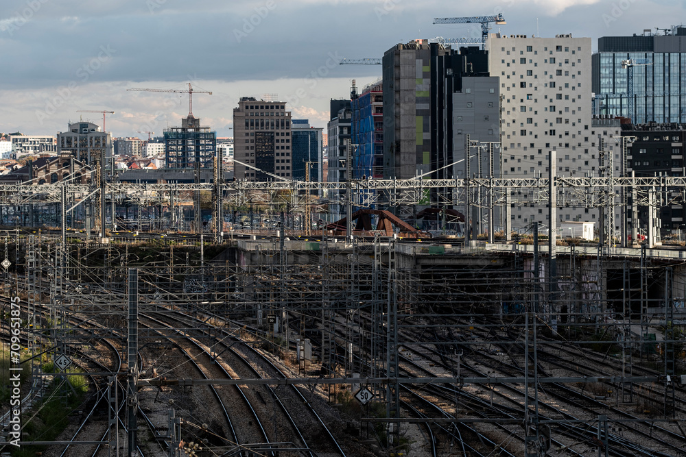 Elevated view of train tracks with a background of apartment and office buildings in the Atocha area in the city of Madrid in Spain Elevated view of train tracks with a background of apartment and office buildings in the Atocha area in the city of Madrid in Spain