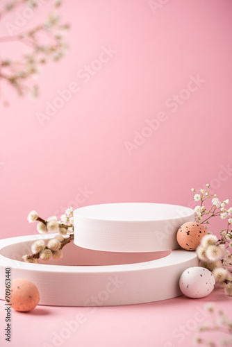 Composition with empty white podiums for products presentation or exhibitions on pink background with Easter quail eggs. Trend Concept with copy space. photo