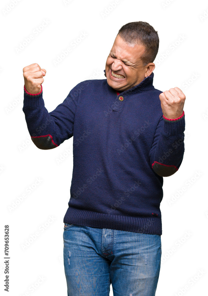 Middle age arab man over isolated background very happy and excited doing winner gesture with arms raised, smiling and screaming for success. Celebration concept. Middle age arab man over isolated background very happy and excited doing winner gesture with arms raised, smiling and screaming for success. Celebration concept.