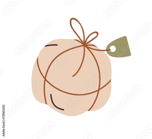 Round gift package in soft paper wrapping. Holiday present box, pack with str...