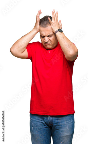 Middle age arab man over isolated background suffering from headache desperate and stressed because pain and migraine. Hands on head.