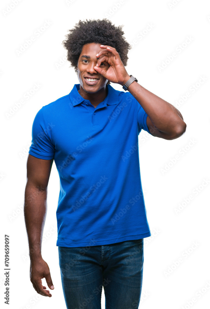 Afro american man over isolated background doing ok gesture with hand smiling, eye looking through fingers with happy face. Afro american man over isolated background doing ok gesture with hand smiling, eye looking through fingers with happy face.